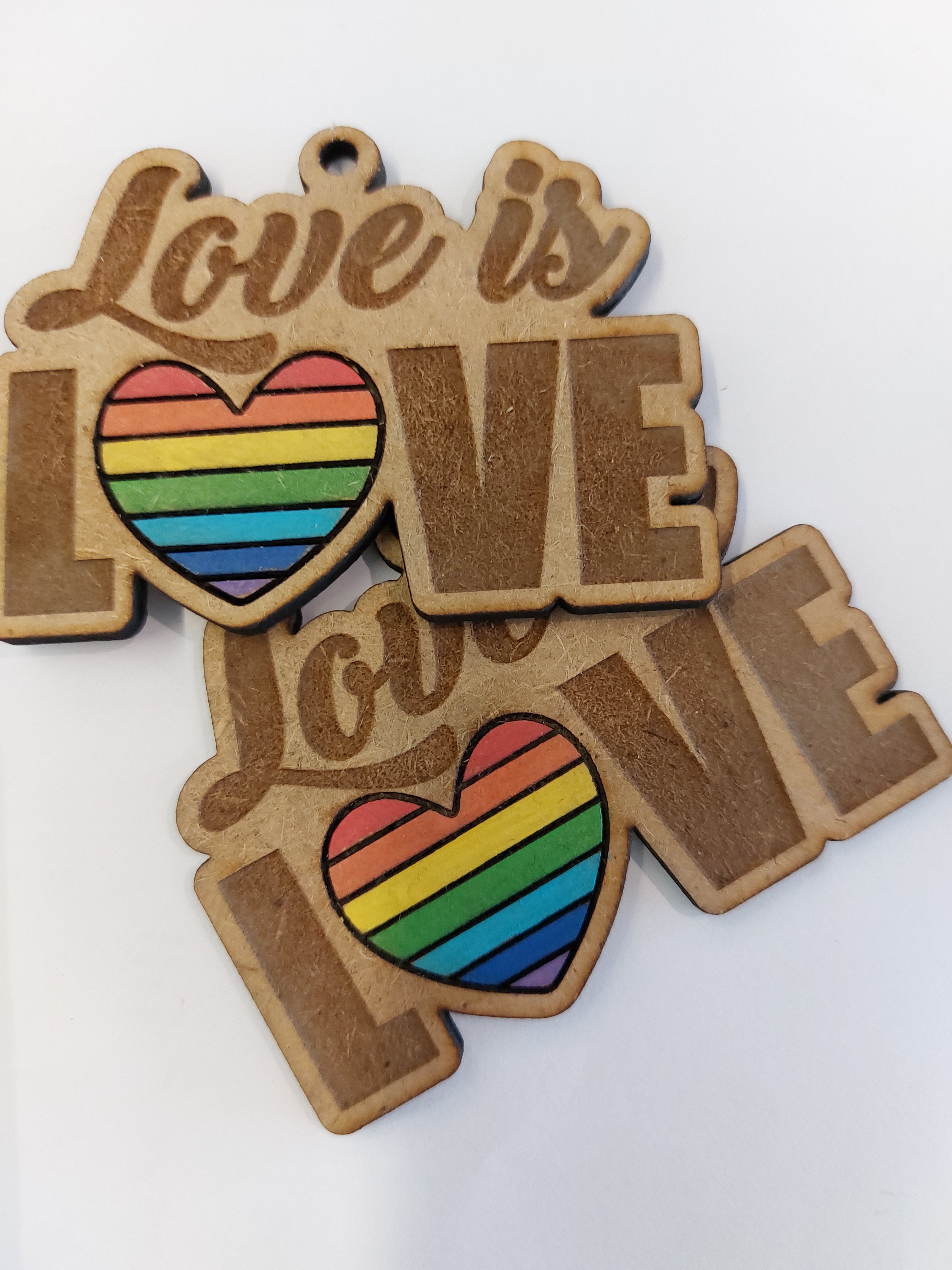 cover image of th tinker Keychain / Earrings Love is Love