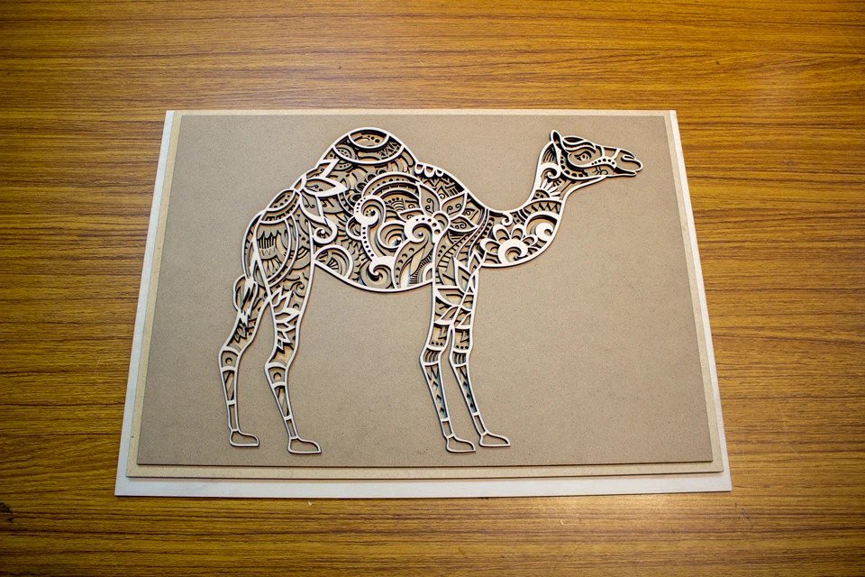 cover image of th tinker Laser cutting camel carving